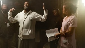 THE DELIVERANCE, foreground from left: director Lee Daniels, Andra Day, on set, 2024. ph: Aaron Ricketts / © Netflix / courtesy of the Everett Collection